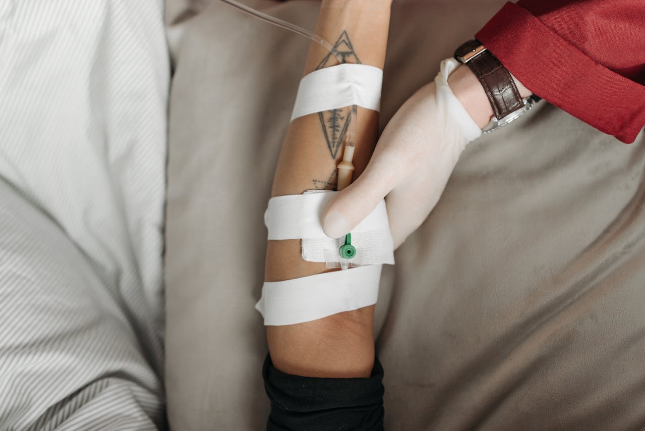 healthcare worker administering an IV